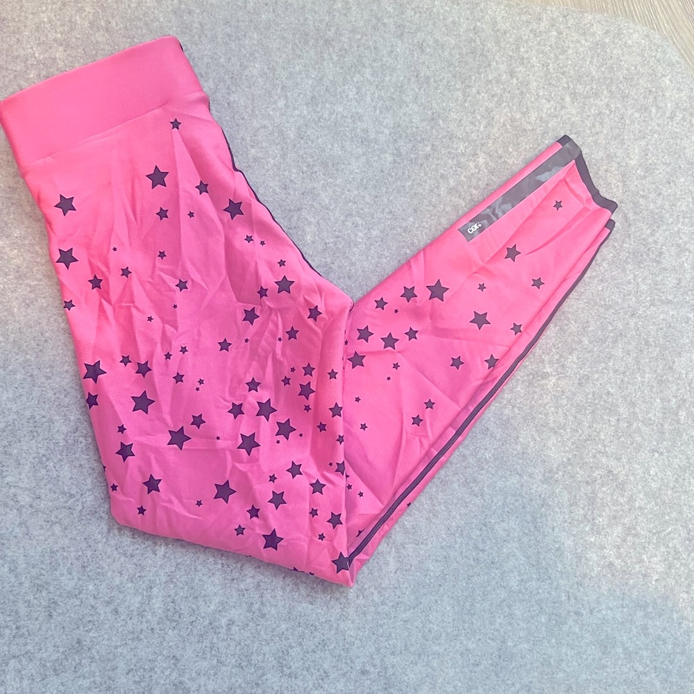 Cor by Ultracor pink seamless leggings with black stars.